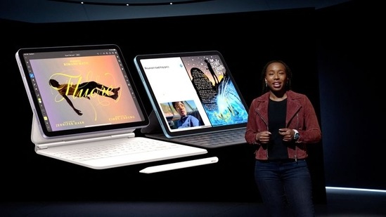 Apple's Angellina Kyazike showcases the new iPad Air along with Magic Keyboard and Apple Pencil during the special event at Apple Park.(REUTERS)