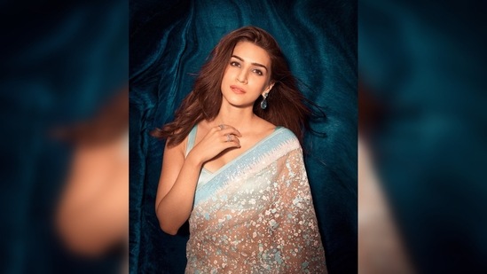 Kriti Sanon kept her look simple yet chic by accessorising it with statement earrings and rings.(Instagram/@kritisanon)