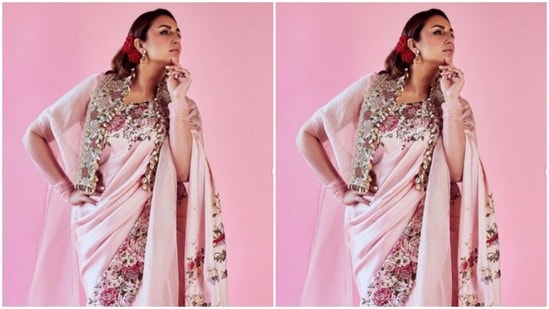 Huma added more drama to her look with shrug of sorts of the same colour around her shoulders. The pastel pink shrug also showcased floral patterns and zari details.(Instagram/@iamhumaq)