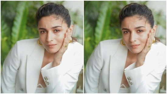 Alia's white dress came with midriff-baring details. The white blazer came detailed in printed buttons near the sleeves and the pockets.(Instagram/@aliabhatt)