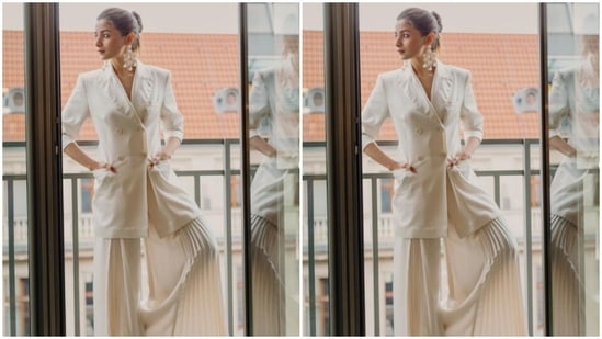 Alia's white attires are a treat for sore eyes. Here's a picture from her trip to Berlinale where she decked up in a white blazer and white satin palazzos.(Instagram/@aliabhatt)