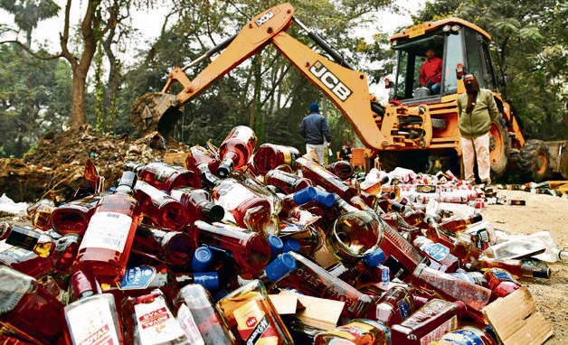 Liquor bottles being destroyed in Patna. (HT PHOTO) Liquor bottles being destroyed in Patna. (HT PHOTO)