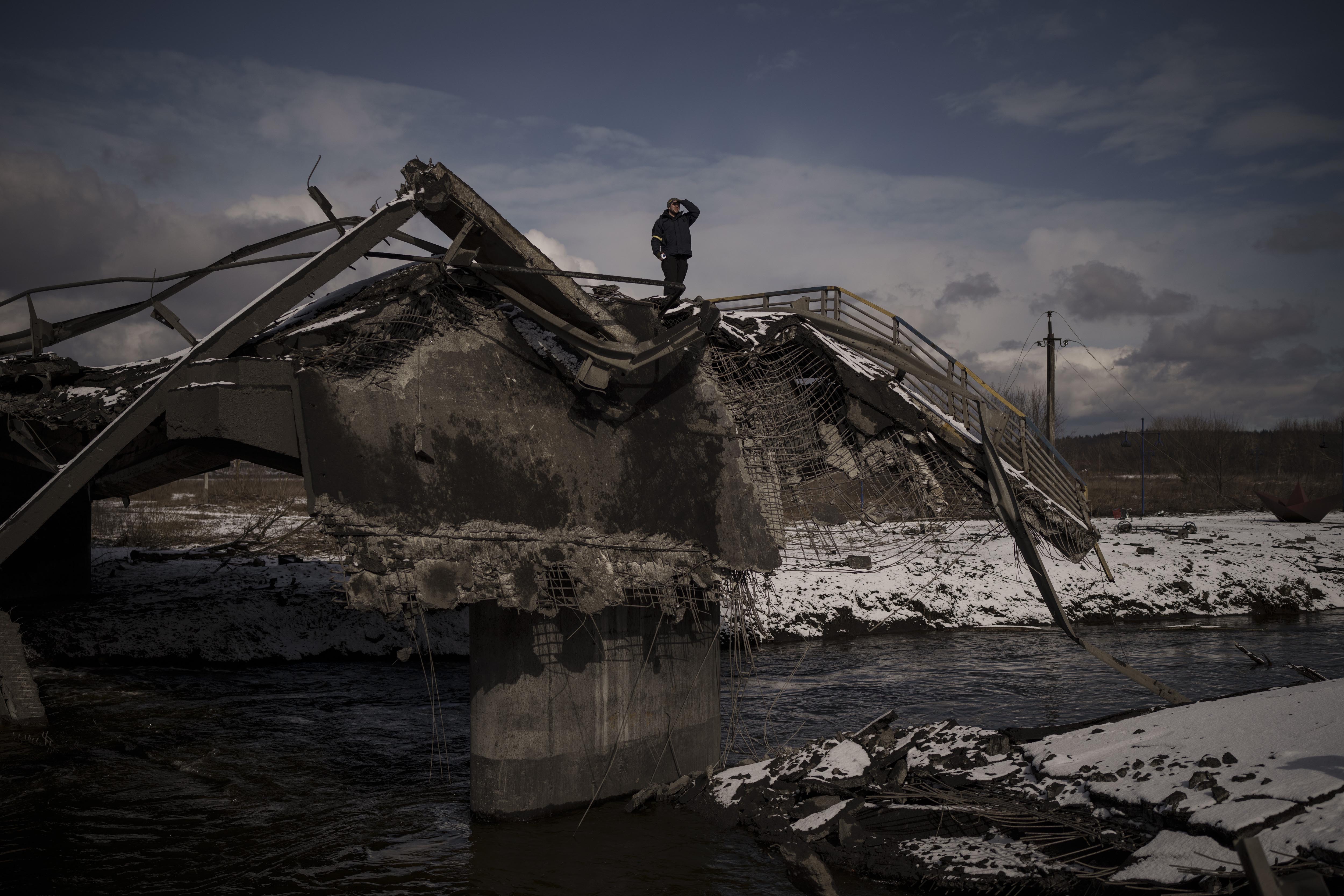 A man stands atop a destroyed bridge in Irpin, on the outskirts of Kyiv. (AP) A man stands atop a destroyed bridge in Irpin, on the outskirts of Kyiv. (AP)