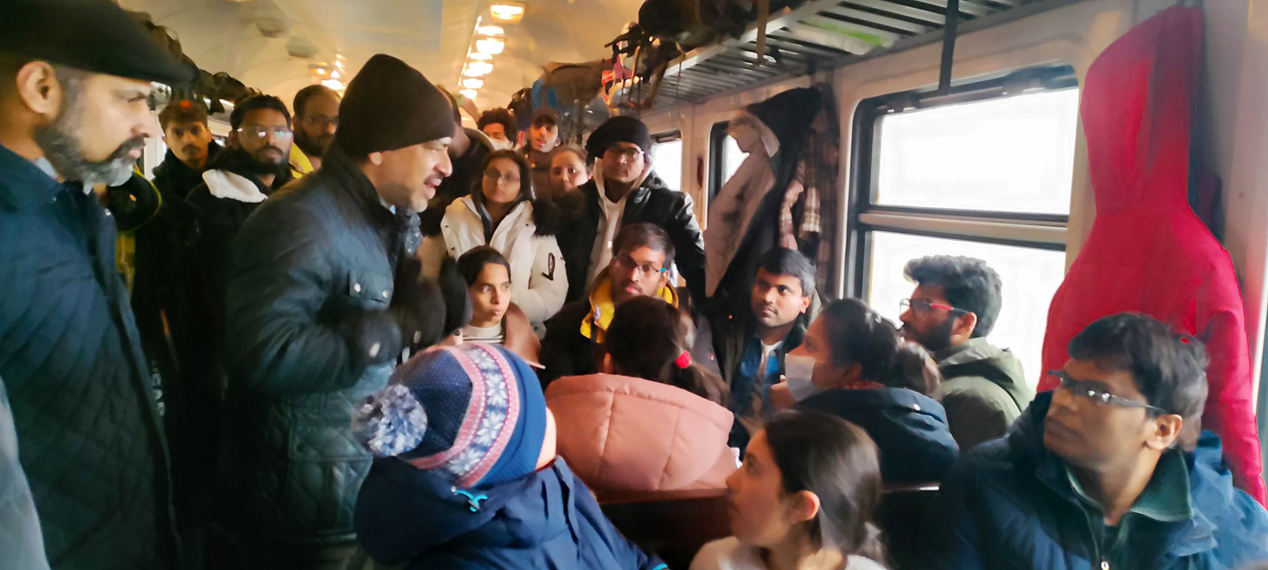 Indian Ambassador to Ukraine Partha Satpathy interacts with Indian students, onboard a special train carrying 600 students from Sumy University at Lviv Railway Station, in Ukraine.&nbsp; (PTI)