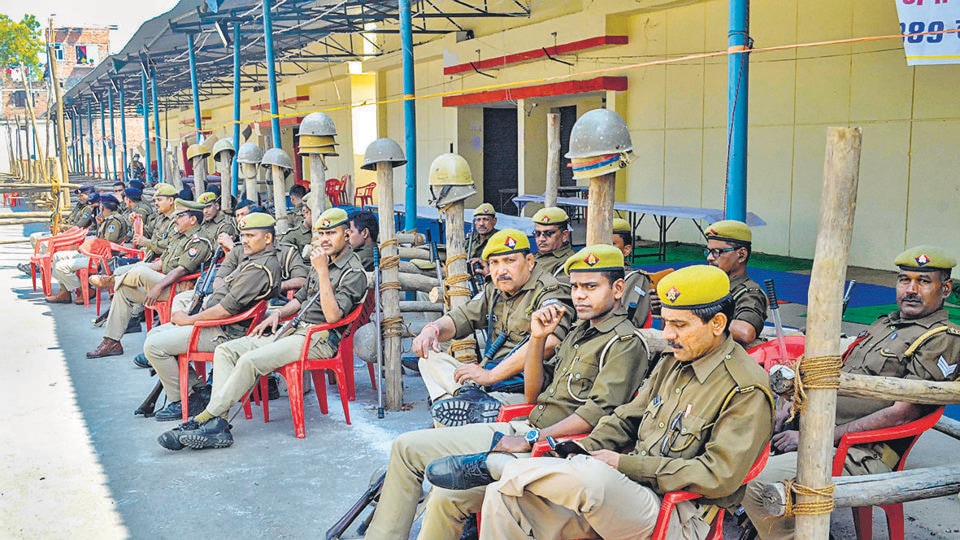 Additional police personnel on duty at Pahariya counting centre, amid controversy over the movement of EVMs, in Varanasi, on Wednesday. (PTI) Additional police personnel on duty at Pahariya counting centre, amid controversy over the movement of EVMs, in Varanasi, on Wednesday. (PTI)