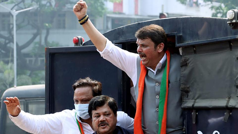 BJP leader Devendra Fadnavis shout slogans after being detained during a protest against Maharashtra government demanding the resignation of state minister Nawab Malik at Azad Maidan in Mumbai on Wednesday. (ANI) BJP leader Devendra Fadnavis shout slogans after being detained during a protest against Maharashtra government demanding the resignation of state minister Nawab Malik at Azad Maidan in Mumbai on Wednesday. (ANI)