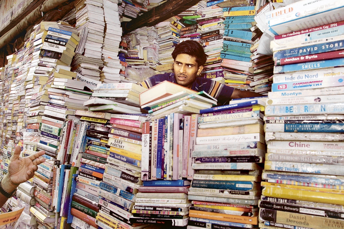 Behind a wall of books: At a second hand book store (Dijeshwar Singh) Behind a wall of books: At a second hand book store (Dijeshwar Singh)