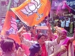 BJP supporters holding party flags, celebrate with colours after the party's lead in the Assam municipal elections, outside the party office, in Dibrugarh on Wednesday. (PTI) BJP supporters holding party flags, celebrate with colours after the party's lead in the Assam municipal elections, outside the party office, in Dibrugarh on Wednesday. (PTI)