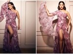 Nushrratt Bharuccha once again impressed the fashion police with her wardrobe choice. She was recently spotted wearing an elegant lilac one-shoulder draped dress for a photoshoot.(Instagram/@nushrrattbharuccha)