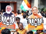 A Bharatiya Janata Party (BJP) supporter holds the cutouts of Prime Minister Narendra Modi and Uttar Pradesh Chief Minister Yogi Adityanath.(ANI) A Bharatiya Janata Party (BJP) supporter holds the cutouts of Prime Minister Narendra Modi and Uttar Pradesh Chief Minister Yogi Adityanath.(ANI)