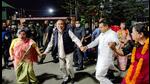 Manipur CM N Biren Singh and Manipur BJP chief A Sharda Devi dance after the party's victory in Assembly polls, in Imphal, Thursday. (PTI)