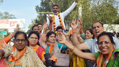 Bharatiya Janata Party supporters celebrate the party's lead in Uttar Pradesh Assembly elections, in Ghaziabad on Thursday. (Agencies) Bharatiya Janata Party supporters celebrate the party's lead in Uttar Pradesh Assembly elections, in Ghaziabad on Thursday. (Agencies)