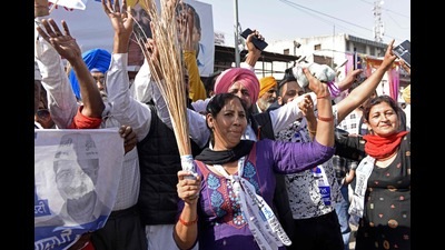 Aam Aadmi Party (AAP) supporters celebrate after their party's win in the Punjab assembly elections, Amritsar, March 10, 2022 (AFP) Aam Aadmi Party (AAP) supporters celebrate after their party's win in the Punjab assembly elections, Amritsar, March 10, 2022 (AFP)