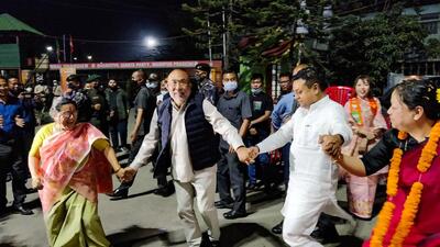 Manipur CM N Biren Singh and Manipur BJP chief A Sharda Devi dance after the party's victory in Imphal, on Thursday. (PTI) Manipur CM N Biren Singh and Manipur BJP chief A Sharda Devi dance after the party's victory in Imphal, on Thursday. (PTI)