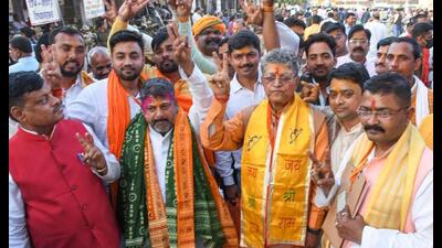 BJP candidates Ved Prakash Gupta (R) from Ayodhya seat and Ram Chandra Yadav (L) from Rudauli seat, celebrate their win in Assembly elections, in Ayodhya, Thursday, (PTI Photo)