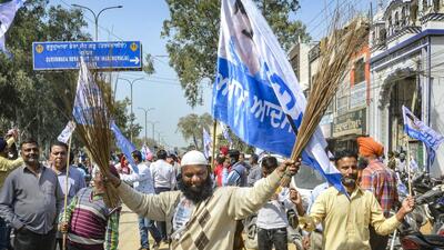 Aam Aadmi Party supporters celebrate their performance in the Punjab assembly elections on Thursday. (PTI Photo) Aam Aadmi Party supporters celebrate their performance in the Punjab assembly elections on Thursday. (PTI Photo)