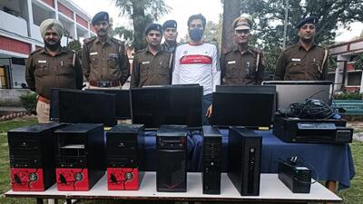 The accused, owner of an immigration firm, in custody of the police in Chandigarh. (HT Photo) The accused, owner of an immigration firm, in custody of the police in Chandigarh. (HT Photo)