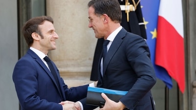 France's President Emmanuel Macron (L) welcomes Netherlands' Prime Minister Mark Rutte before a working lunch about the Russian invasion of Ukraine. (AFP) France's President Emmanuel Macron (L) welcomes Netherlands' Prime Minister Mark Rutte before a working lunch about the Russian invasion of Ukraine. (AFP)