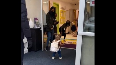 The image, taken from the Reddit video, shows the girl walking inside the daycare all by herself. (Reddit/@heguywhosteals)