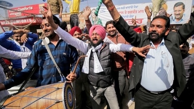Supporters of the Aam Aadmi Party (AAP) celebrate after learning of the initial poll results in Amritsar (REUTERS)