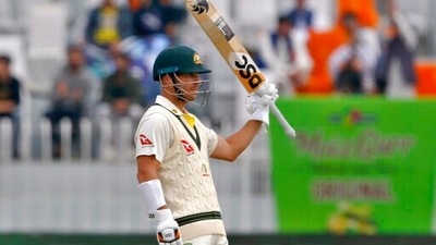 Australia's David Warner celebrate after completing 50 runs during the 3rd day of first Test match between Pakistan and Australia at the Pindi Stadium, in Rawalpindi, Pakistan. (AP) Australia's David Warner celebrate after completing 50 runs during the 3rd day of first Test match between Pakistan and Australia at the Pindi Stadium, in Rawalpindi, Pakistan. (AP)