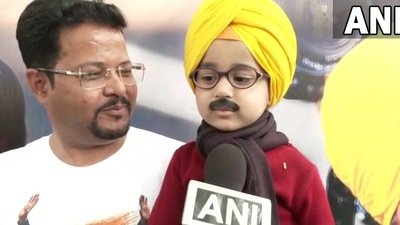 Punjab Election Result 2022: The image shows a kid dressed as Arvind Kejriwal and Bhagwant Mann . (Twitter/@ANI) Punjab Election Result 2022: The image shows a kid dressed as Arvind Kejriwal and Bhagwant Mann . (Twitter/@ANI)