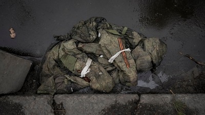 A Russian military uniform lies on the pavement in Irpin, on the outskirts of Kyiv, Ukraine, Wednesday, March 9, 2022. (AP/Vadim Ghirda) A Russian military uniform lies on the pavement in Irpin, on the outskirts of Kyiv, Ukraine, Wednesday, March 9, 2022. (AP/Vadim Ghirda)