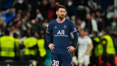 PSG's Lionel Messi reacts after Real Madrid scored their third goal during the Champions League, round of 16, second leg match between Real Madrid and Paris Saint-Germain at the Santiago Bernabeu stadium in Madrid. (AP)