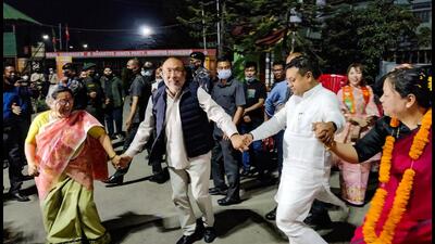 Manipur CM N Biren Singh and Manipur BJP chief A Sharda Devi dance after the party's victory in Assembly polls, in Imphal, Thursday. (PTI) Manipur CM N Biren Singh and Manipur BJP chief A Sharda Devi dance after the party's victory in Assembly polls, in Imphal, Thursday. (PTI)