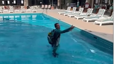 Carey could be seen throwing his phone after falling in the pool. (Pat Cummins Instagram) Carey could be seen throwing his phone after falling in the pool. (Pat Cummins Instagram)