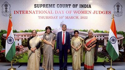 Chief Justice of India (CJI) Justice NV Ramana, flanked by women judges of the Supreme Court, at a programme to commemorate the first ever ‘International Day of Women Judges’, in New Delhi, Thursday. (PTI)