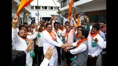 BJP workers celebrate the party’s assembly polls victory at BJP city office, Shivajinagar on Thursday. (Rahul Raut/HT PHOTO) BJP workers celebrate the party’s assembly polls victory at BJP city office, Shivajinagar on Thursday. (Rahul Raut/HT PHOTO)