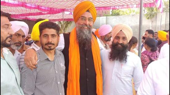 Aam Aadmi Party MLA Kultar Sandhwan with supporters after retaining the Kotkapura assembly segment in Faridkot district on Thursday. (HT Photo)