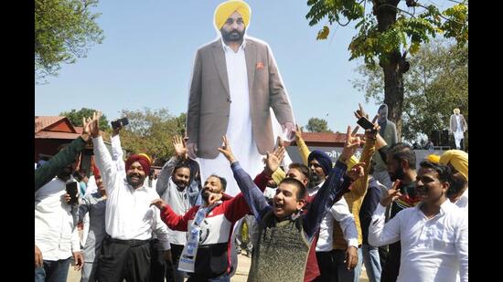 Aam Aadmi Party supporters celebrating the stunning victory of the AAP in Punjab on Thursday. For once, restive Punjab, caught in a subliminal churn of anger and aspirations, has inflicted a collective punishment on an entrenched political class and reset the political dynamics like never before. (Keshav Singh/HT)