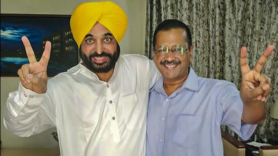 Delhi chief minister and AAP convener Arvind Kejriwal with his party's Punjab CM candidate Bhagwant Mann. (PTI Photo)