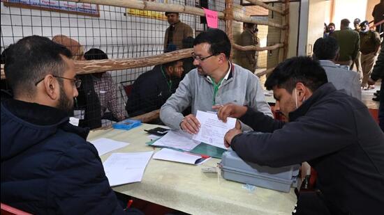 Counting process at a polling booth in Tehri district. (HT Photo)
