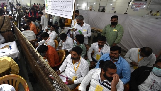 Polling agents are seen at a center during the counting of the Uttar Pradesh state assembly election votes in Noida on March 10, 2022. (Photo by Money SHARMA / AFP) Polling agents are seen at a center during the counting of the Uttar Pradesh state assembly election votes in Noida on March 10, 2022. (Photo by Money SHARMA / AFP)