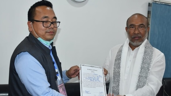 Manipur chief minister N Biren Singh receives his victory certificate from the returning officer on Thursday.(HT Photo)