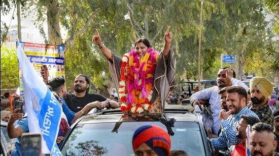 AAP candidate from Nakodar constituency Inderjit Kaur Mann with supporters celebrates her victory in the Punjab Assembly polls, in Jalandhar, on Thursday. Amid a landslide victory in the state, AAP managed a gain in Doaba, the hub of Dalit politics in the state. (PTI)