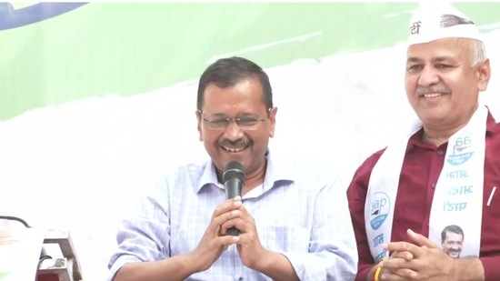 AAP supremo and Delhi chief minister Arvind Kejriwal (L) along with deputy chief minister of the the national capital address a gathering Punjab after their party made a clean sweep in the border state on Thursday, March 10, 2022. (ANI Photo)