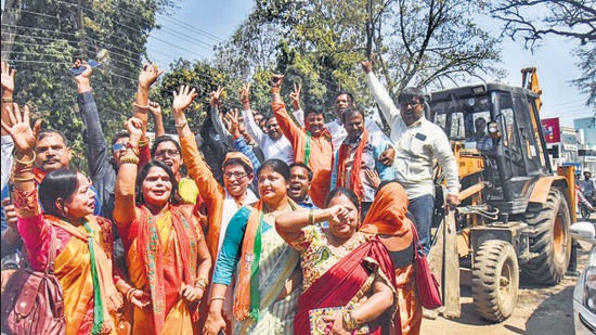 BJP supporters celebrate the results in Gorakhpur. (PTI)