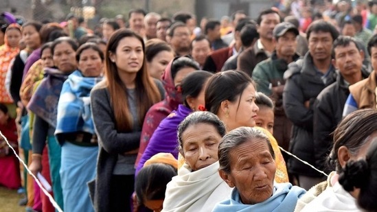 People stand in a queue to cast their votes in the last phase of Manipur election.(PTI File Photo)