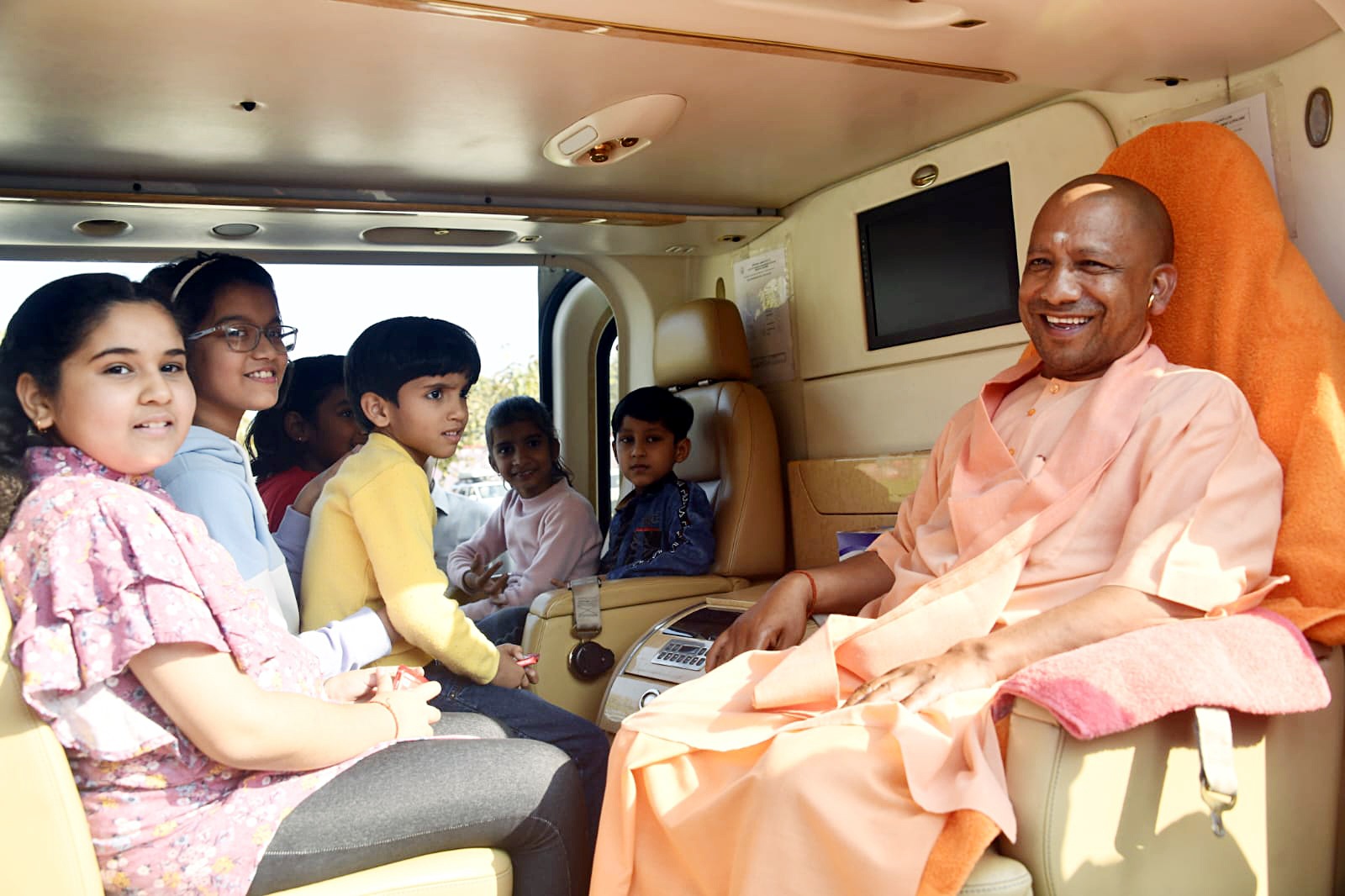 Gorakhpur, Mar 09 (ANI): Uttar Pradesh Chief Minister Yogi Adityanath enjoys a helicopter ride with children, in Gorakhpur. (ANI Photo) (Pawan Kumar) Gorakhpur, Mar 09 (ANI): Uttar Pradesh Chief Minister Yogi Adityanath enjoys a helicopter ride with children, in Gorakhpur. (ANI Photo) (Pawan Kumar)
