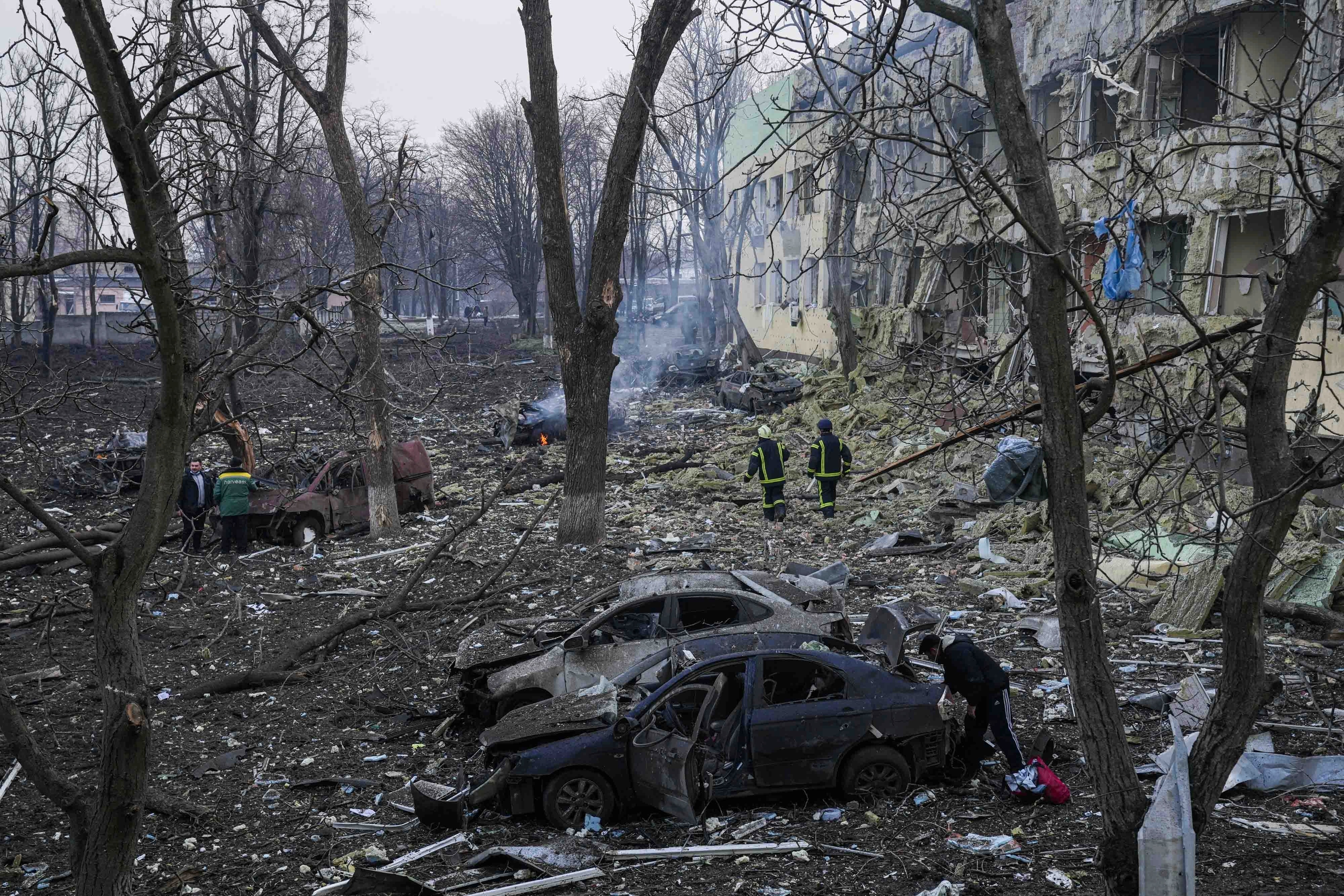Ukrainian emergency employees work at a maternity hospital damaged by shelling in Mariupol, Ukraine, Wednesday, March 9, 2022.&nbsp; (AP)