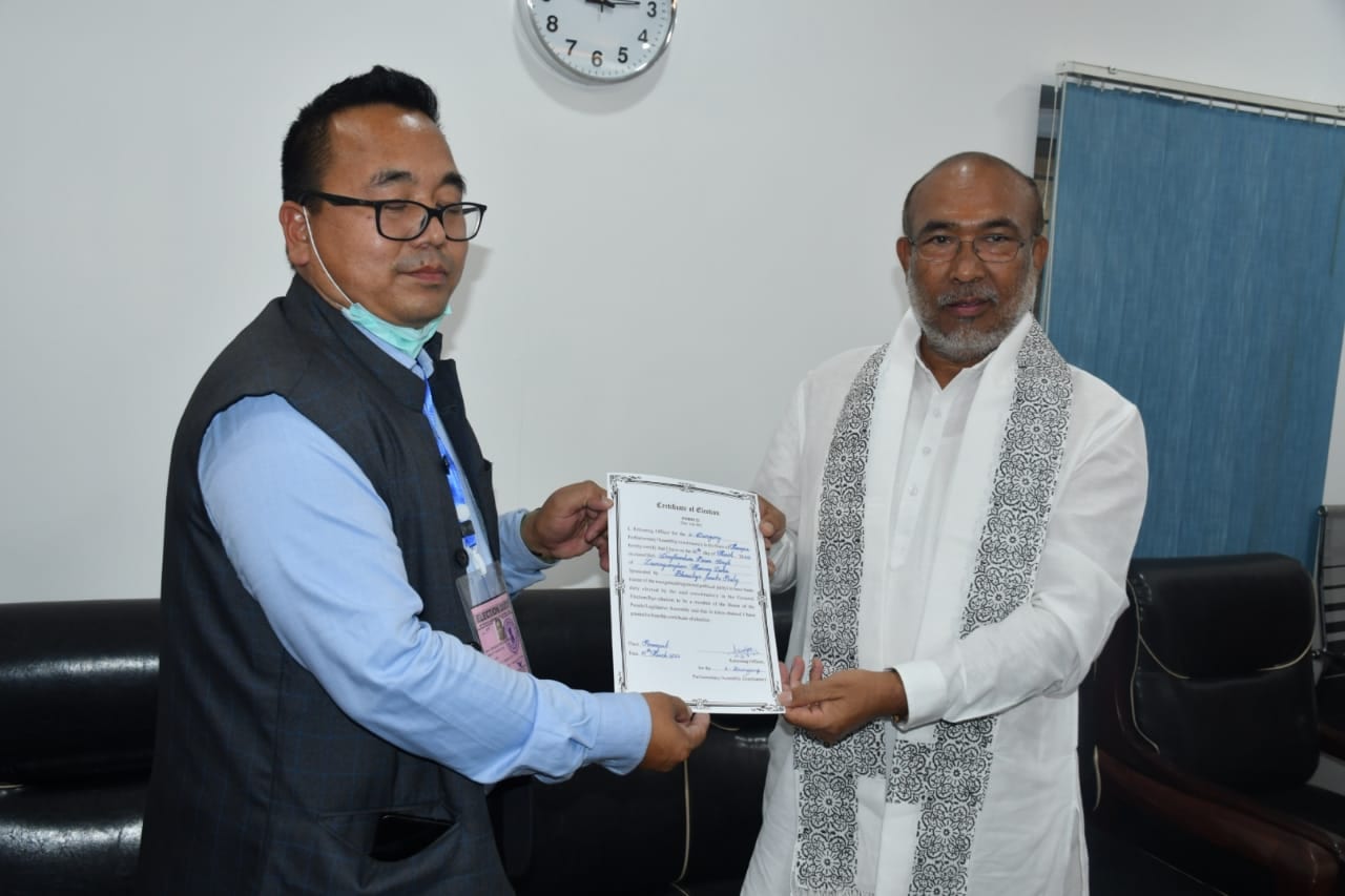 Manipur chief minister N Biren Singh receives his victory certificate from the returning officer on Thursday. (HT Photo) Manipur chief minister N Biren Singh receives his victory certificate from the returning officer on Thursday. (HT Photo)