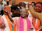 Uttar Pradesh chief minister Yogi Aditynath celebrates with party workers in Lucknow after winning the state elections on Thursday. (ANI Photo)(HT_PRINT) Uttar Pradesh chief minister Yogi Aditynath celebrates with party workers in Lucknow after winning the state elections on Thursday. (ANI Photo)(HT_PRINT)