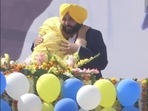 AAP's Punjab chief ministerial candidate Bhagwant Mann hugs his mother Harpal Kaur after his party won the assembly elections in the border state on Thusrday, March 10, 2022. Former cricketer Harbhajan Singh tweeted the photo to congratulate Mann. (Harbhajan Singh/Twitter)