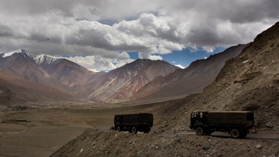 File photo, Indian army trucks drive near Pangong Tso lake near the India China border in India's Ladakh area. (AP) File photo, Indian army trucks drive near Pangong Tso lake near the India China border in India's Ladakh area. (AP)