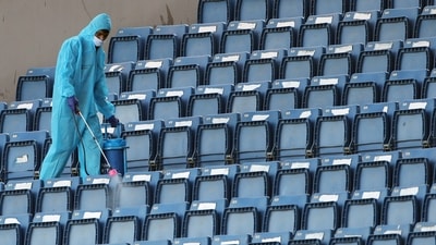 Bengaluru, Mar 10 (ANI): A worker in PPE sprays disinfectants to sanitize the spectator's area ahead of the second test match between India and Sri Lanka, at M.Chinnaswamy Stadium, in Bengaluru on Thursday. (ANI Photo) (Surjeet Kumar) Bengaluru, Mar 10 (ANI): A worker in PPE sprays disinfectants to sanitize the spectator's area ahead of the second test match between India and Sri Lanka, at M.Chinnaswamy Stadium, in Bengaluru on Thursday. (ANI Photo) (Surjeet Kumar)