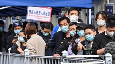 People queue up to be tested as a measure against the Covid-19 coronavirus at the Shanghai Jin'an Central Hospital, in Shanghai. (AFP)